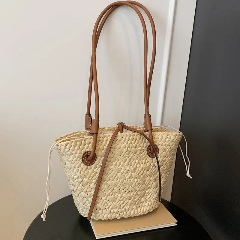 European retro style woven bag in khaki colour showing woven texture and horizontal square shape