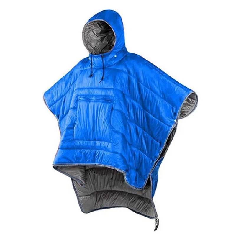 Grey outdoor cloak sleeping bag worn as a cape, showing its large 200x140cm size and hooded design.
