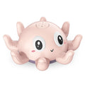 Blue automatic water spray bath toy shaped like an octopus with flashing lights, for baby bath time.
