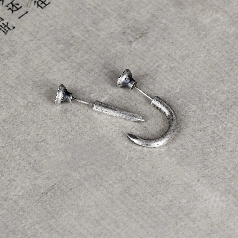 Sterling silver nail stud earrings in straight and curved punk designs