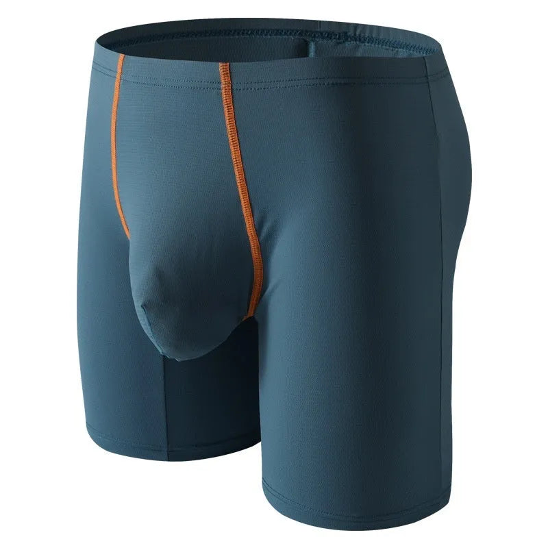 Men's mid-waist nylon boxer shorts in light green with a U-convex pouch, laid flat.