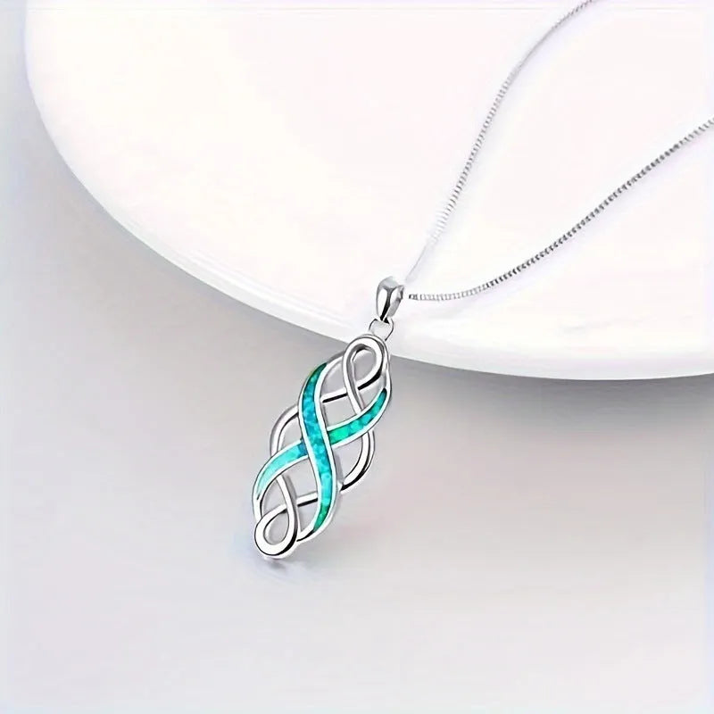 Blue alloy Irish Celtic pendant necklace on cross chain with ellipse and ring motif