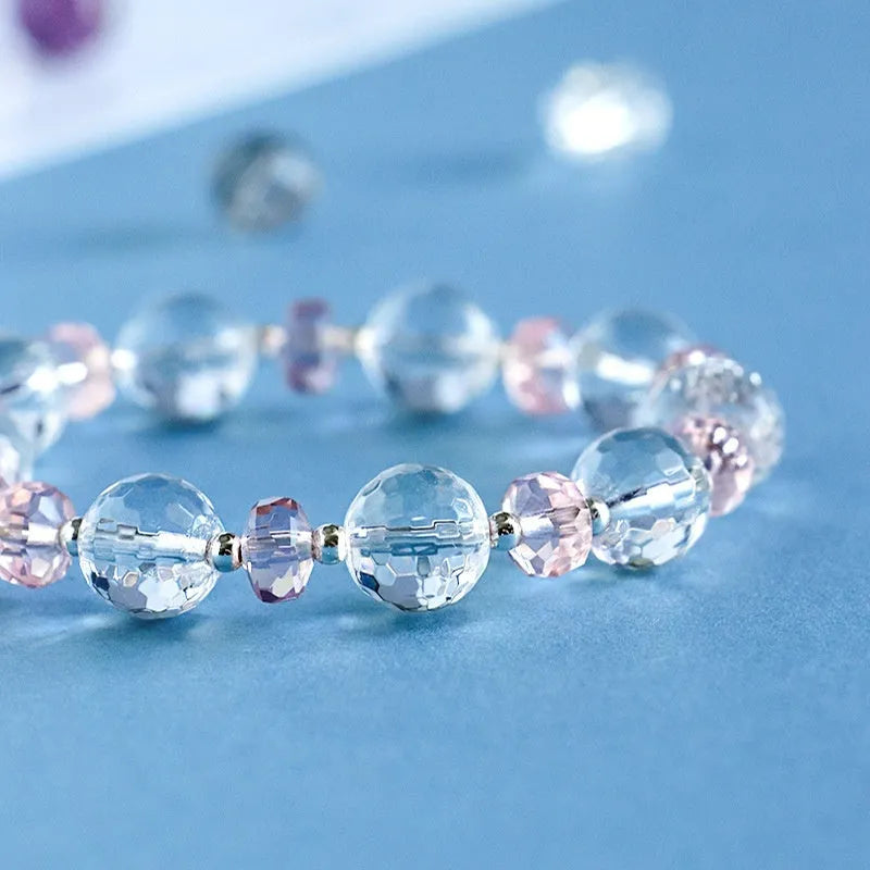 Women's white crystal bracelet with lucky cat charm and diamond design elements