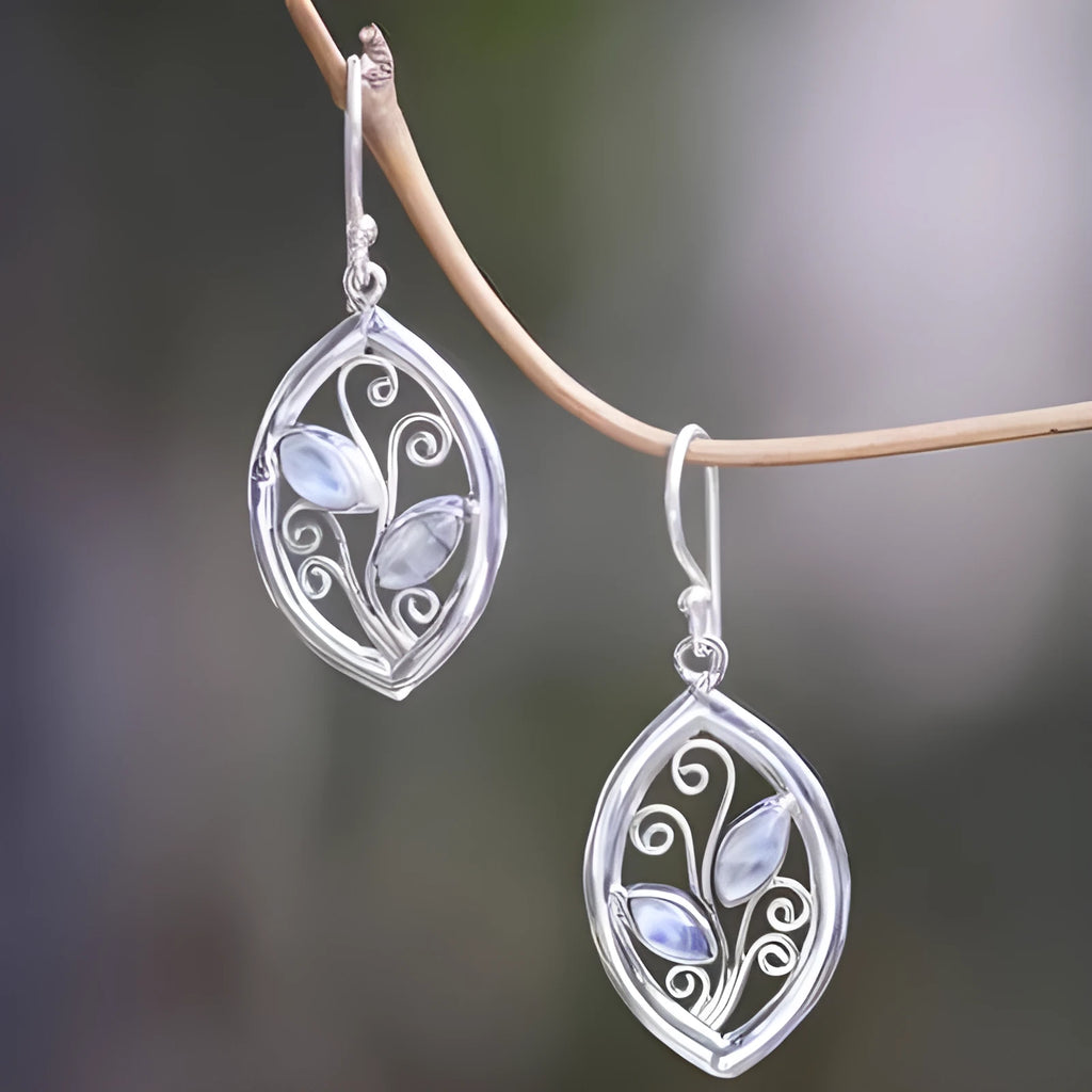 Silver colour leaves-shaped earrings with colourful moonstone embedded in centre