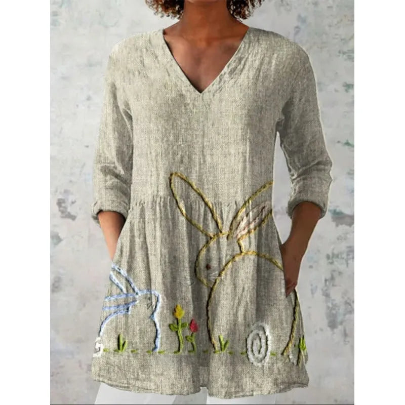 Women's loose-fitting dress with a wave print pattern, wide waist, and three-quarter length sleeves.