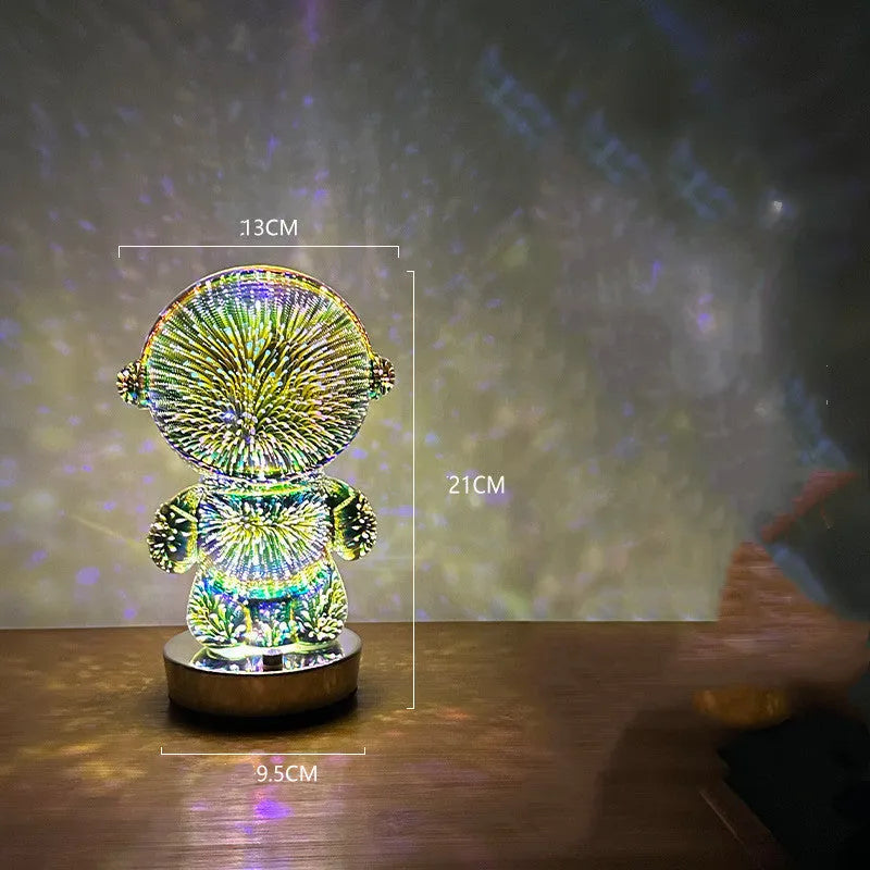 3D stereo astronaut atmosphere light with glass shade and USB charging on a desk