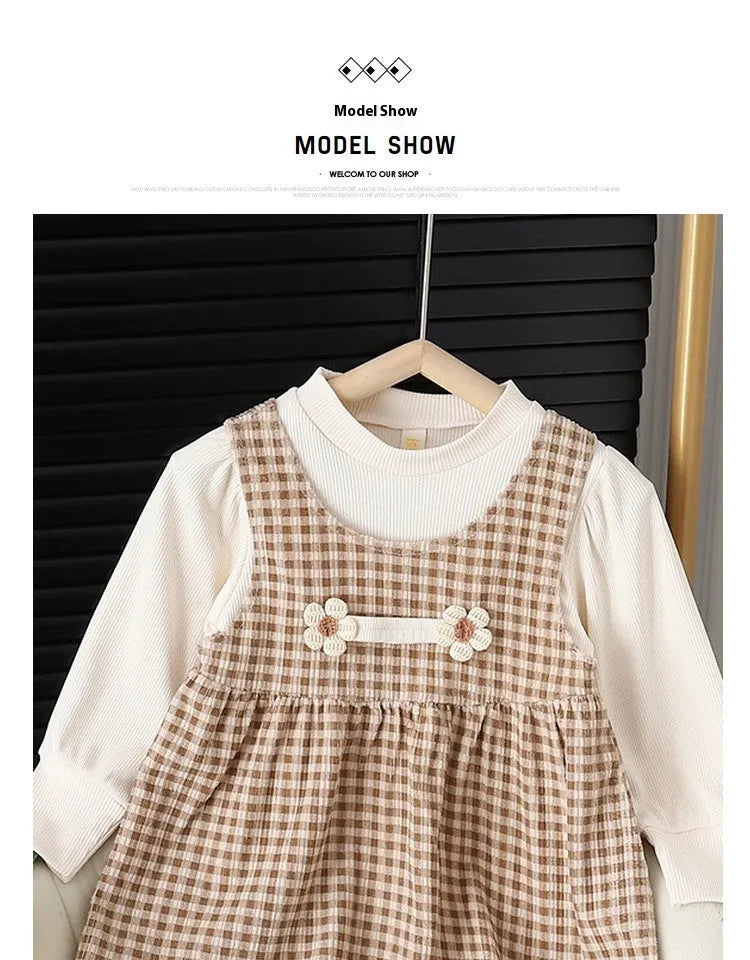 Baby girl wearing a dark coffee plaid long-sleeved dress and matching shirt, Korean style two-piece set.