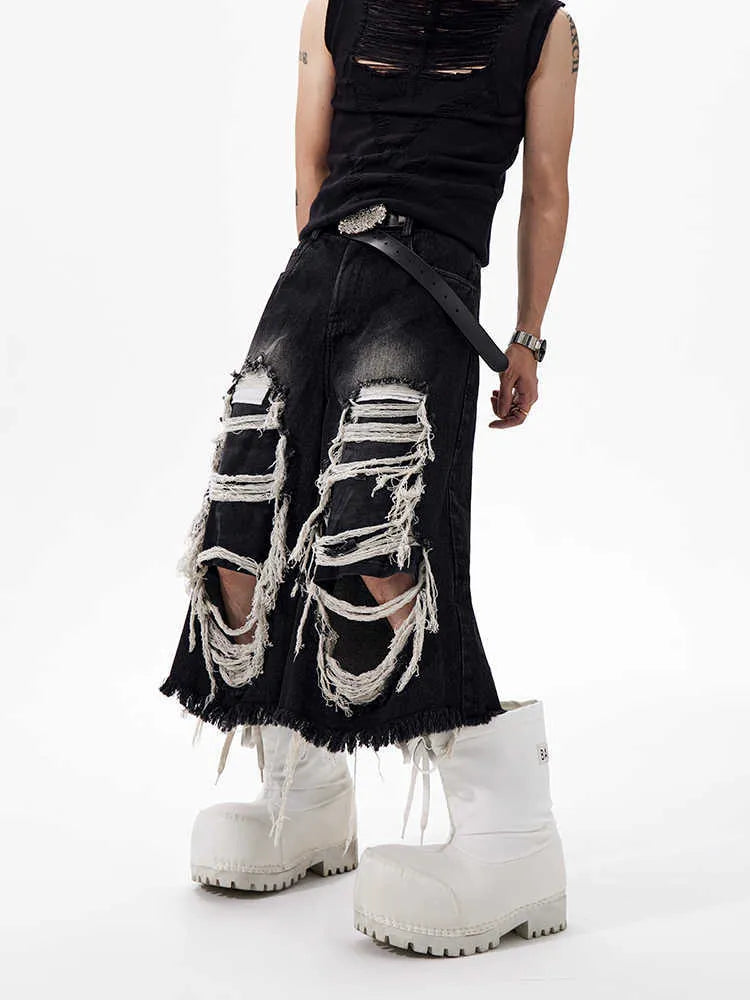 Black women's cropped wide-leg jeans with ripped patch detail on mid-high waist.