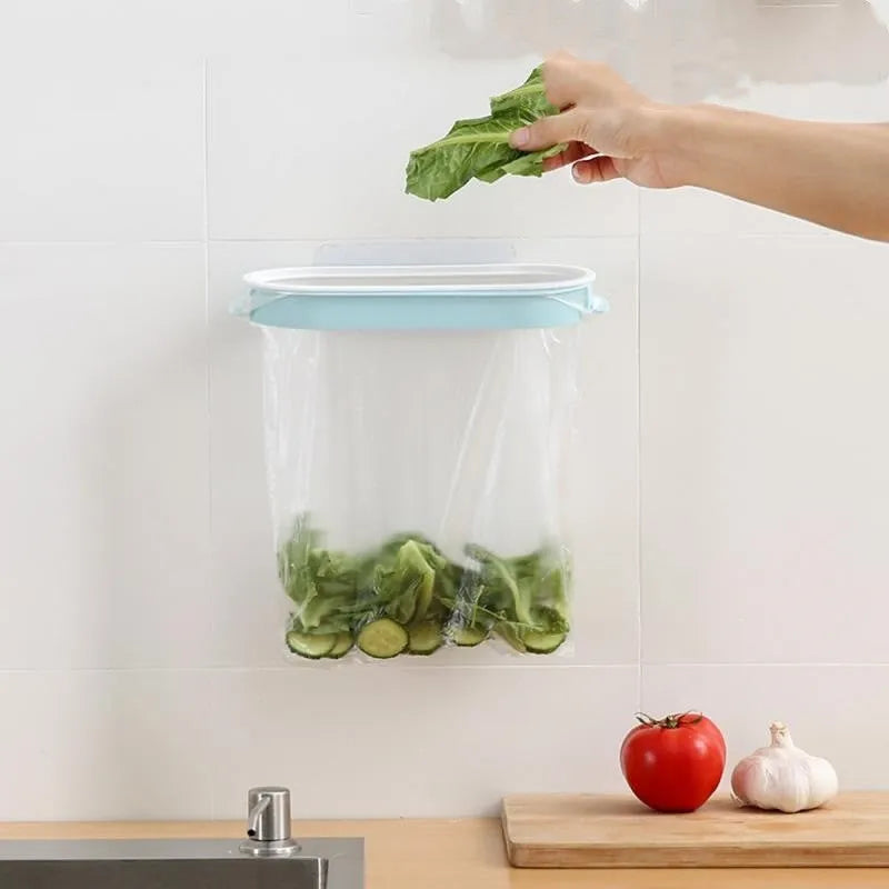 Blue plastic T-shaped kitchen cabinet storage rack for holding a roll of bin bags.
