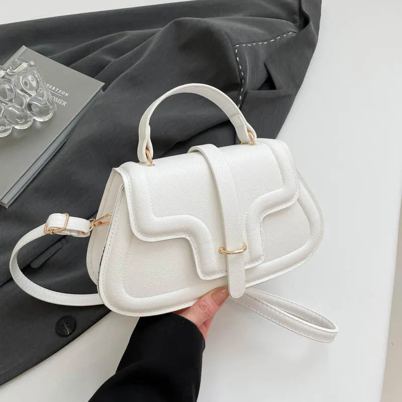 Simple PU shoulder bag in black, white or red with single strap and horizontal square shape.