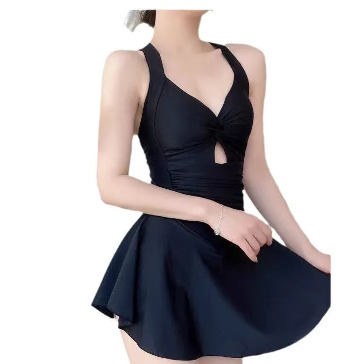 Women's solid colour conservative one-piece swimsuit with backless design