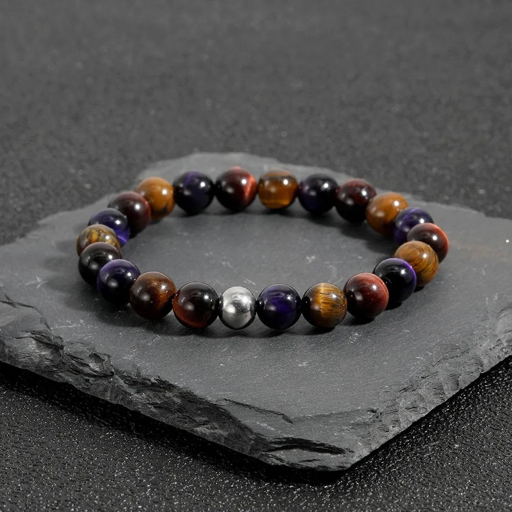 Handmade elastic bracelet with natural tiger-eye stone beads in a geometric minimalist design.