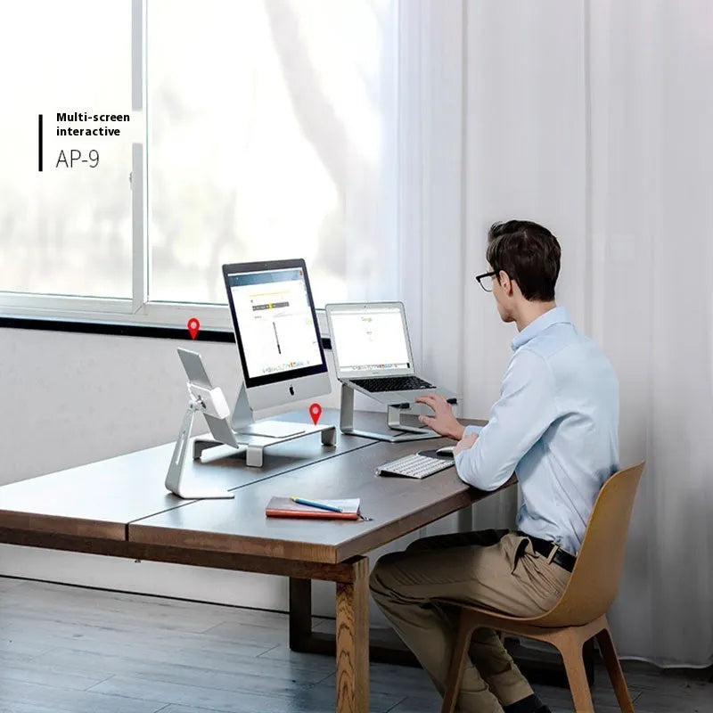 Black aluminium alloy laptop stand on wooden desk with laptop positioned on top