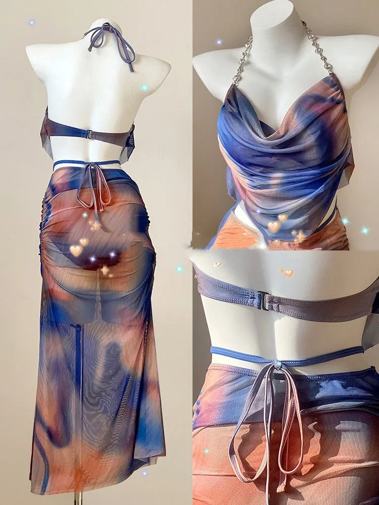 Women's blue printed bikini set with steel support top, pants, and matching skirt laid flat.