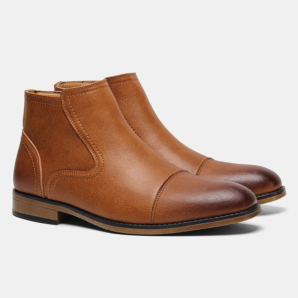 Men's brown Chelsea boot with side zipper, round toe, low heel, and wooden sole.