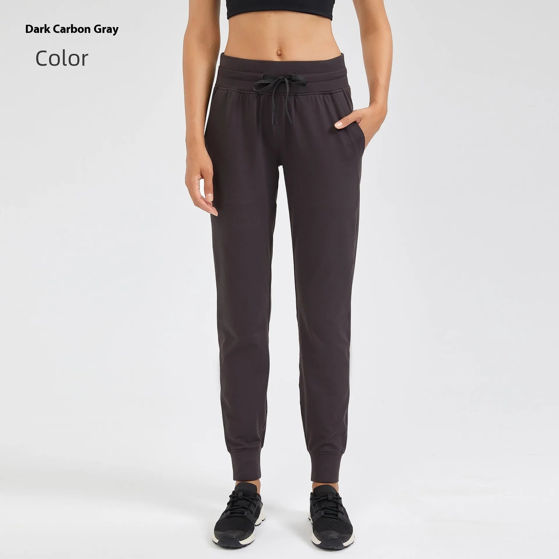 Women's high-waisted yoga pants with a drawstring waistband in a cotton blend fabric.