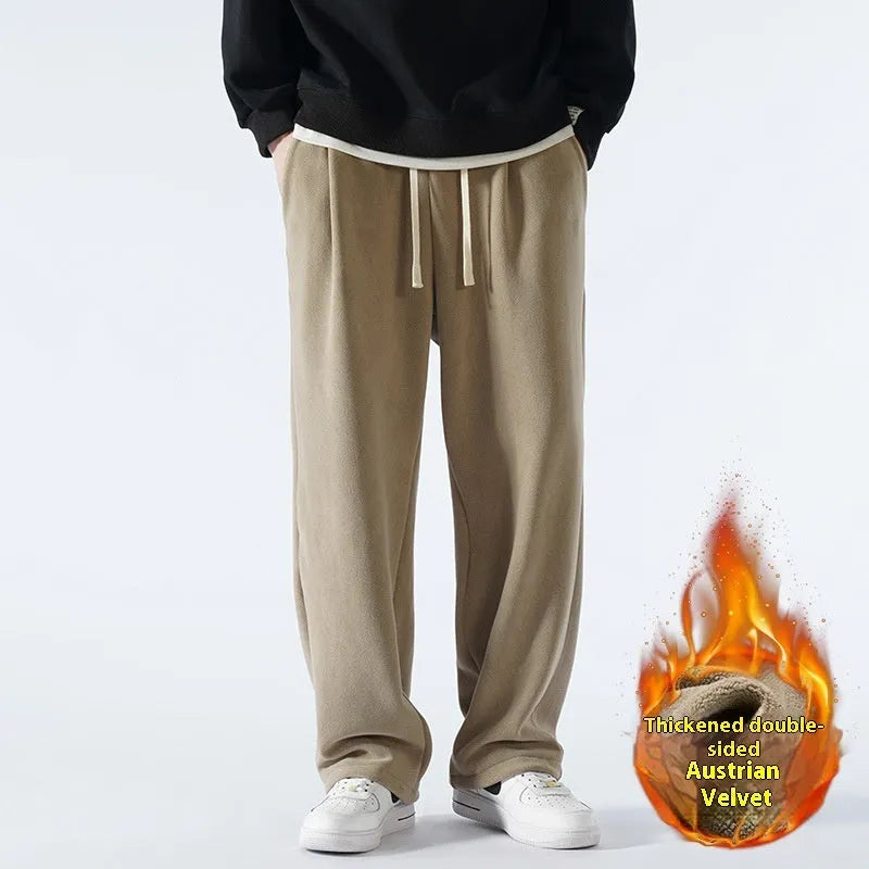 Men's apricot coloured loose-fit polar fleece-lined casual winter trousers on a white background.