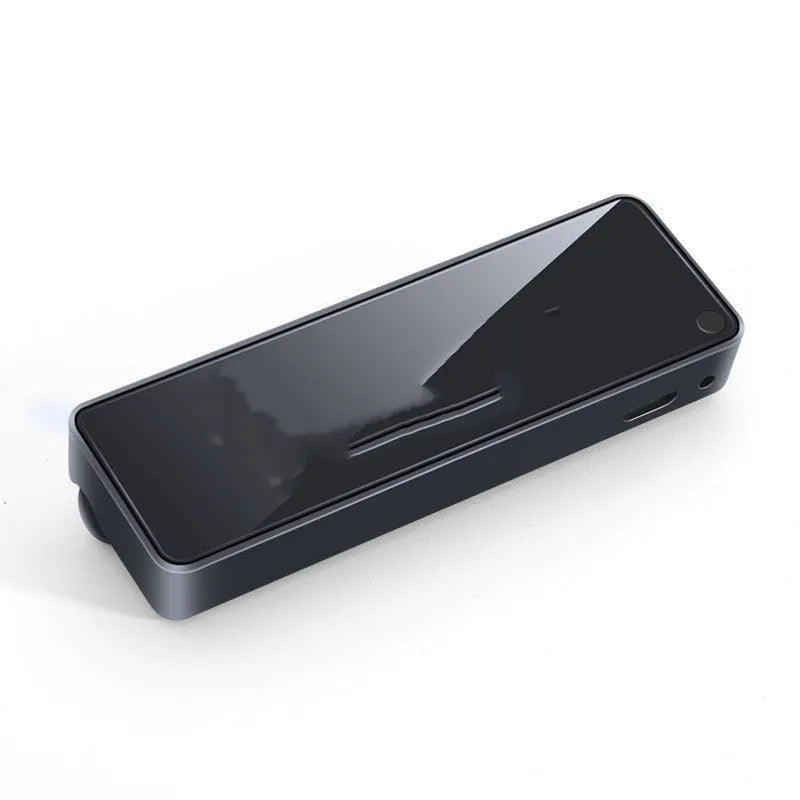 Black car air vent perfume diffuser with LED lighting mounted on vehicle dashboard