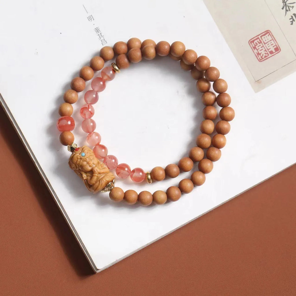 Brown sandalwood bracelet with South Red Zachilam patterns and 6mm round wooden beads
