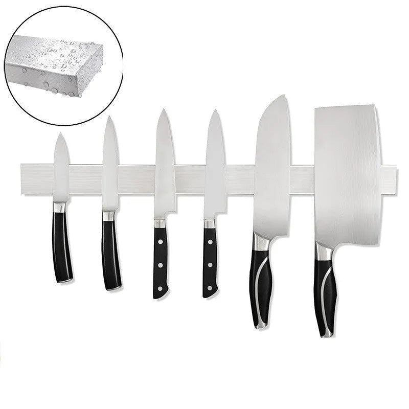 Stainless steel wall-mounted kitchen knife storage rack on white wall