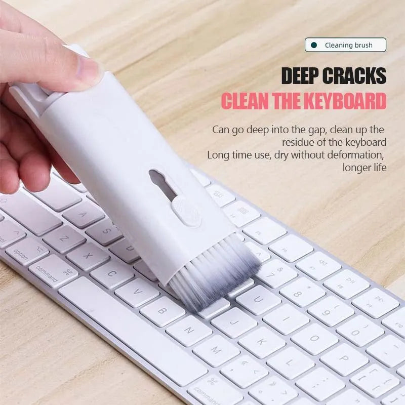 White multifunctional electronic cleaning kit with foldable pen, retractable brush, keycap puller, and spray bottle.