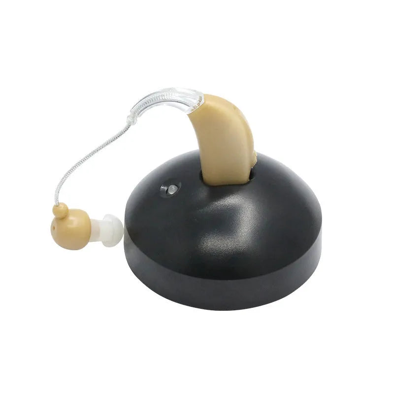 Black silicone rechargeable hearing aid amplifier with USB charging cable for the elderly.