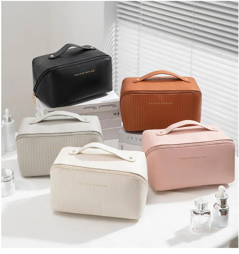 Vertical pattern pillow makeup bag in PU leather with cubic 22.5cm dimensions for travel storage