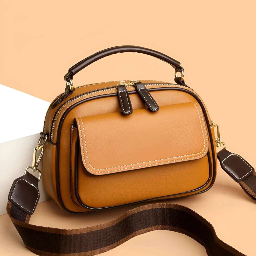 Women's black PU cross-body shoulder bag showing square shape and double connector straps