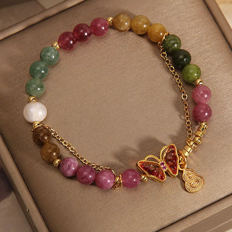 Women's tourmaline butterfly gourd bracelet with agate, showing jade coloured carved centrepiece.