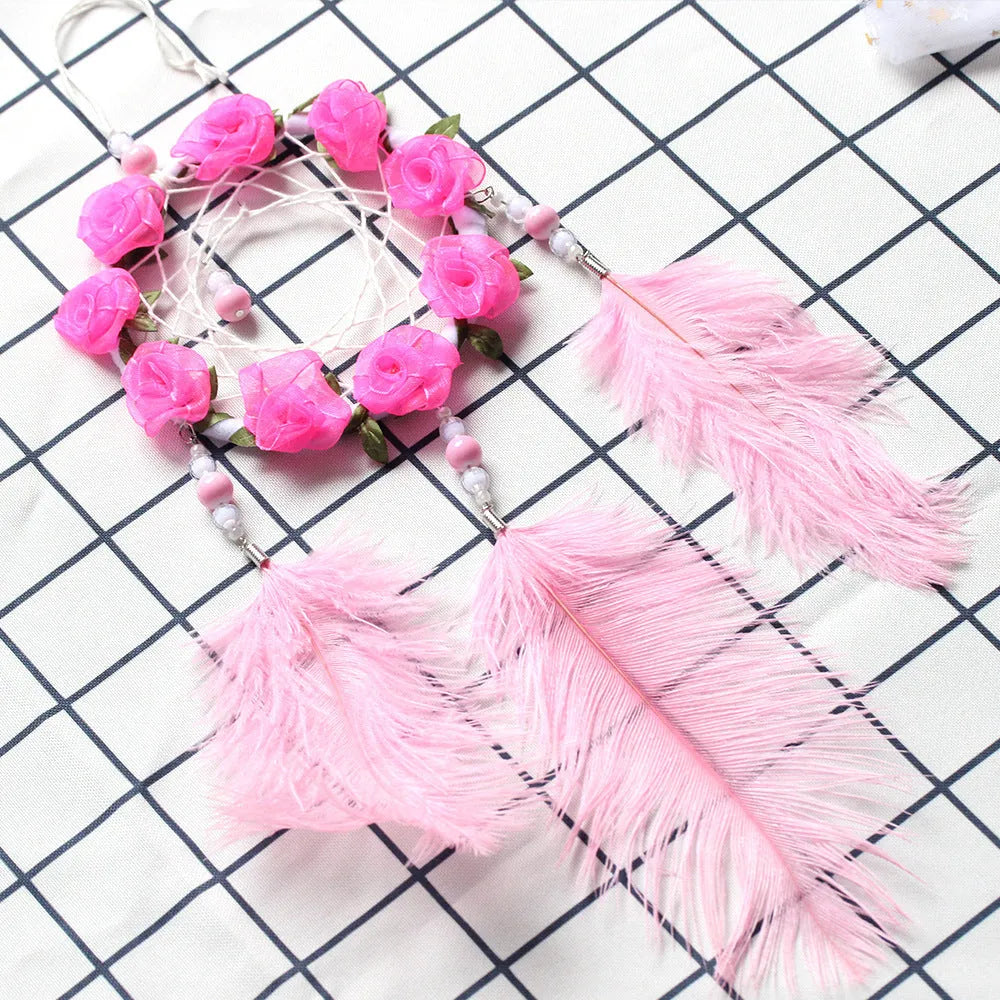 Pink dreamcatcher wind chime with ostrich feather ornaments, 10cm diameter wall decoration