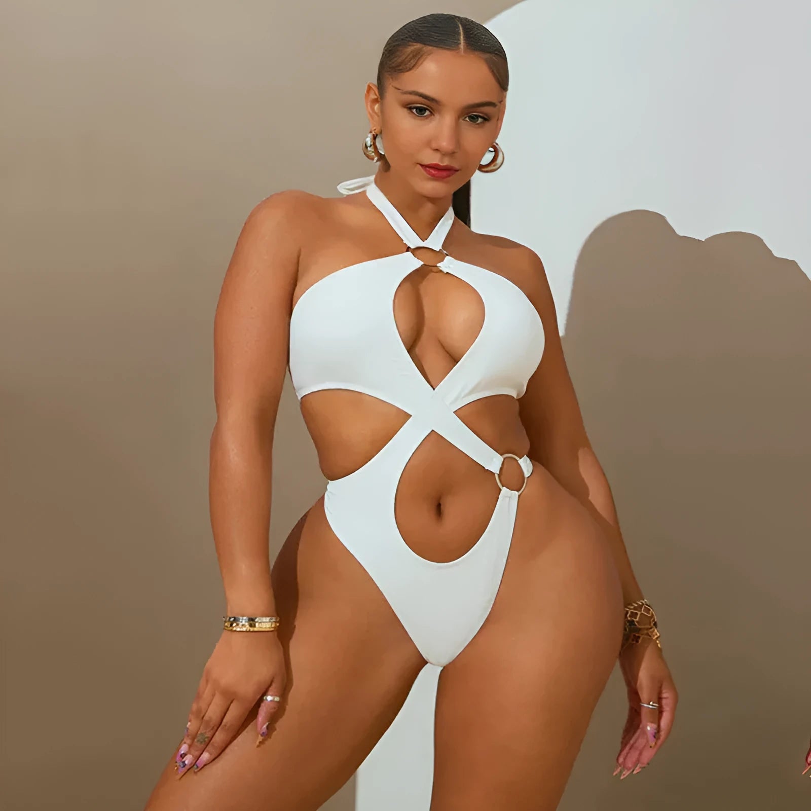 Women's white sleeveless jumpsuit with lace-up back and tapered shorts on hanger