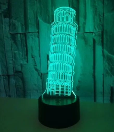 3D acrylic Leaning Tower of Pisa night light glowing in blue on a black base with remote control.