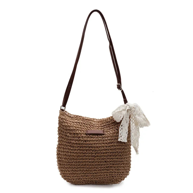 Women's woven straw messenger bag with hollowed design in khaki colour