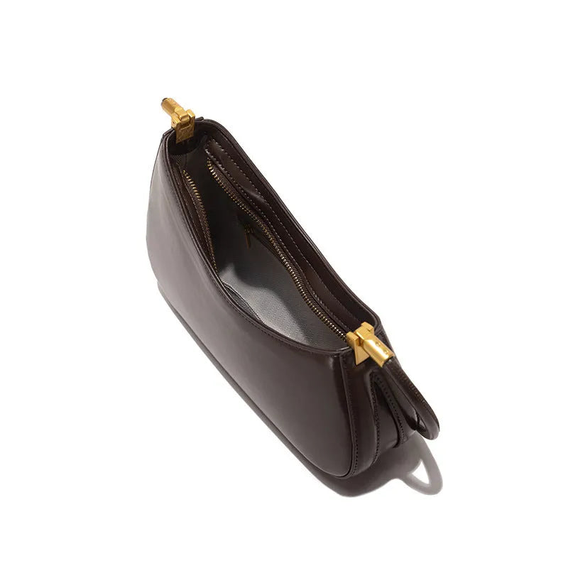 Women's retro oval underarm bag in PU leather available in seven colours with internal zipper organiser