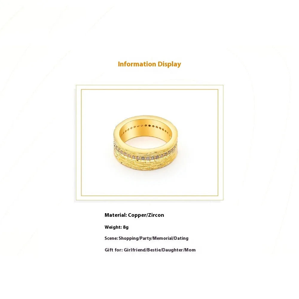Gold geometric women's zircon ring on a copper base, shown in size 7.