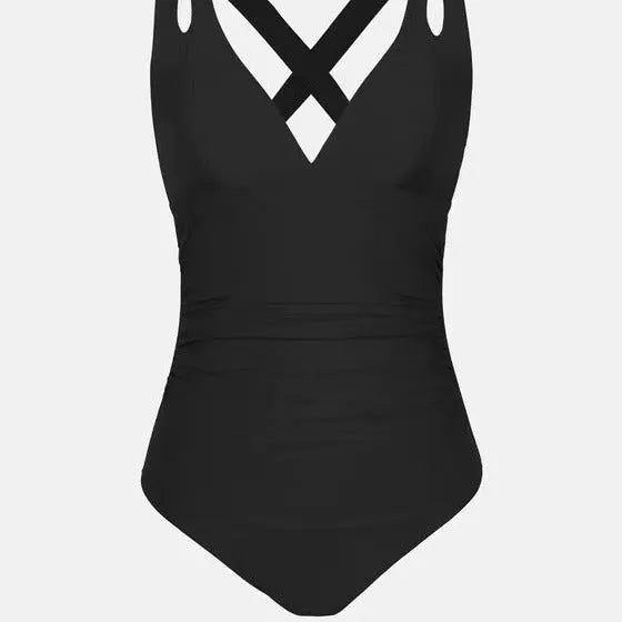 Solid colour one-piece bikini swimsuit with cross shoulder straps on a mannequin