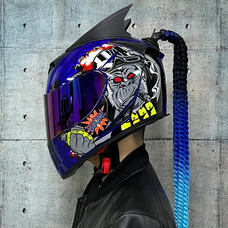 Dirty Braids graphic full face motorcycle helmet shown in black clown and blue diamond designs.