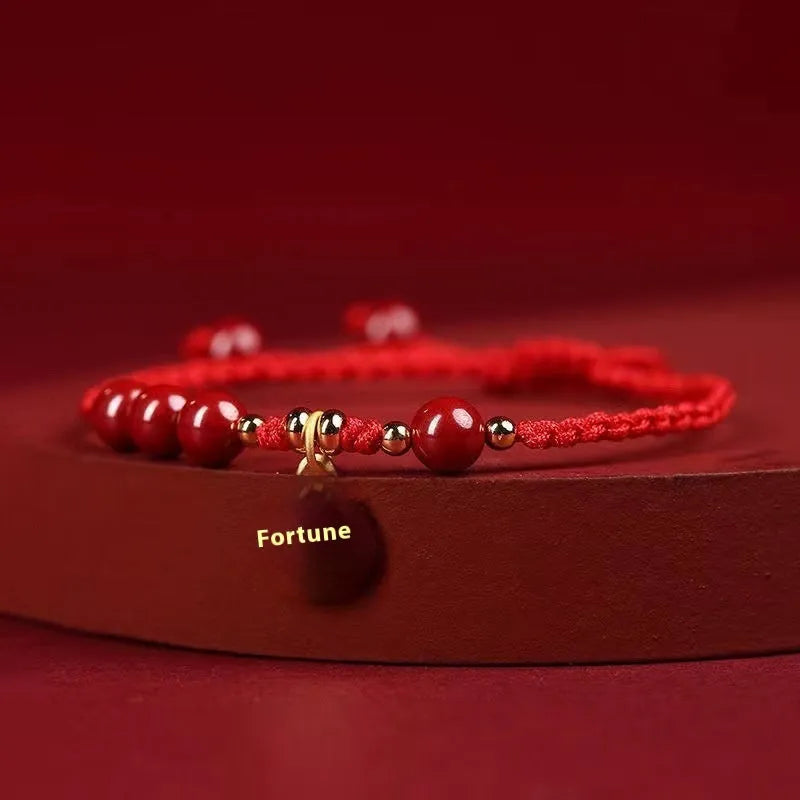 Cinnabar exam luck bracelet with braided rope strap and choice of bead or flower charm in ethnic style