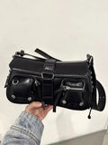 Black women's messenger bag with adjustable shoulder strap showing zipper pocket interior