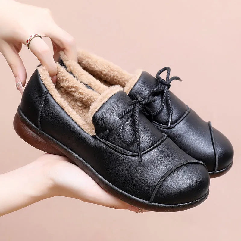 Black flat non-slip slip-on fleece-lined warm shoes with microfiber upper and round toe