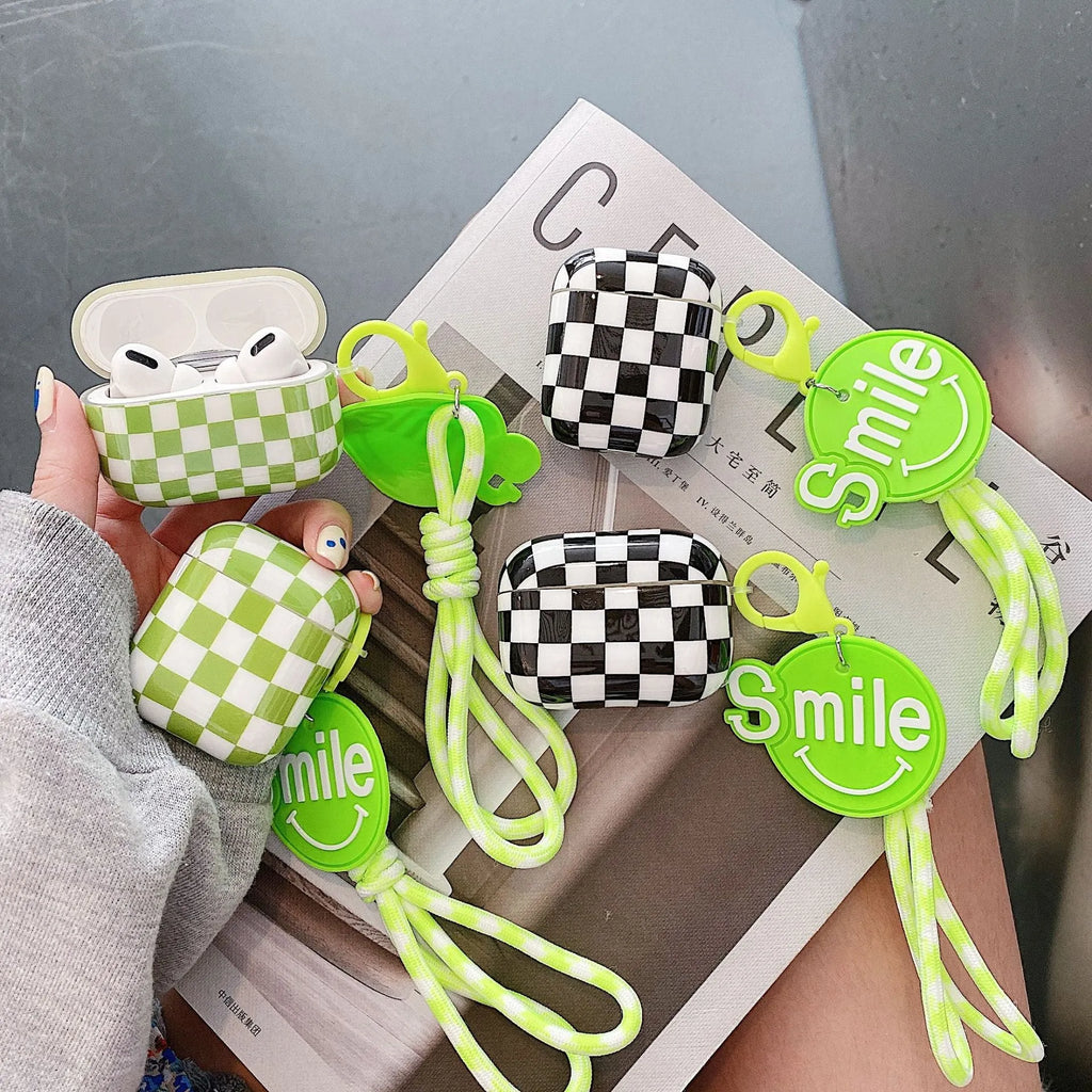 Black and green checkerboard pattern TPU case for Apple AirPods with optional lanyard and pendant accessories.