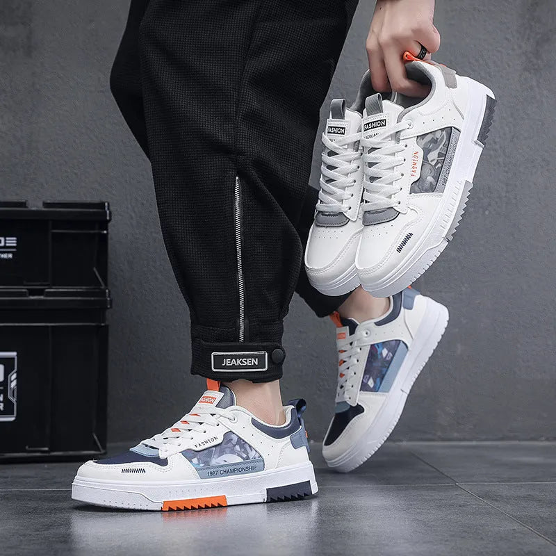 Men's white casual sneakers with lace-up front, low heel, and mesh lining, side view.