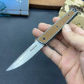 CRKT 7190 folding fruit knife with stainless steel blade shown closed and open, in black, brown, or red colour options.