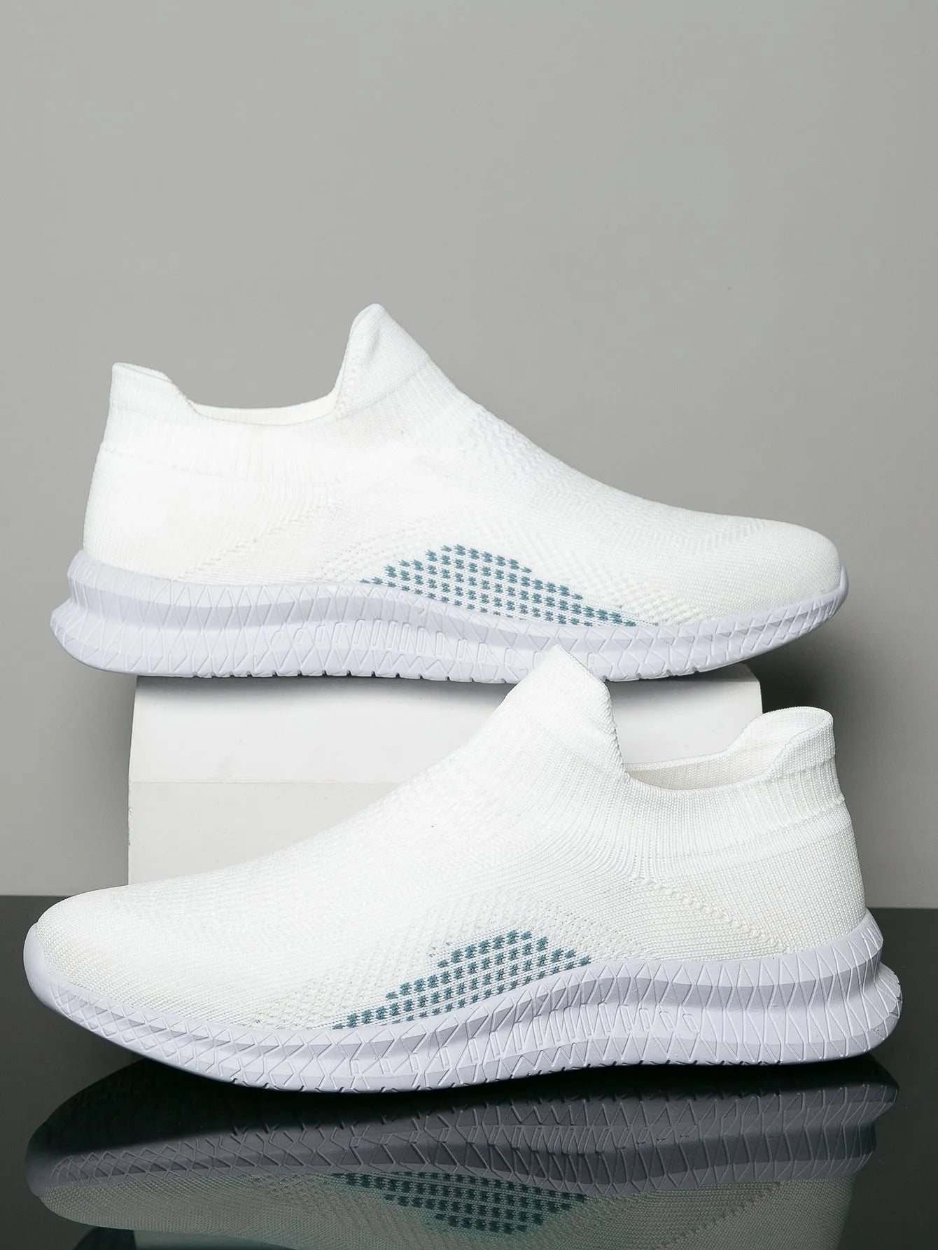 Popcorn flyknit fabric casual sneaker in black, low top with round toe and flat heel.