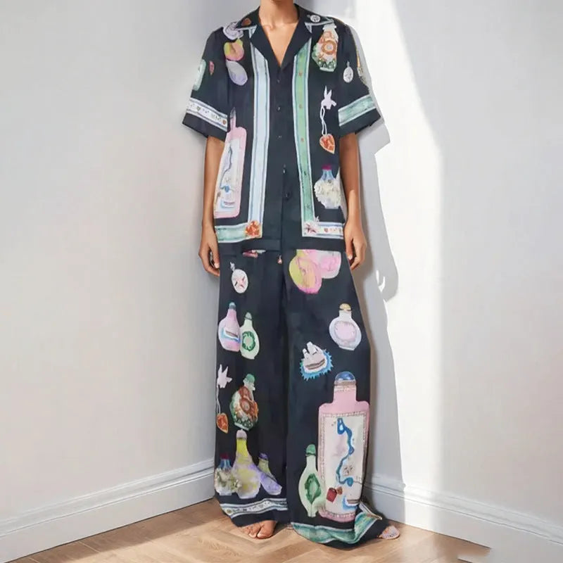 Black women's casual set with cartoon print, featuring a sleeve cardigan and trousers