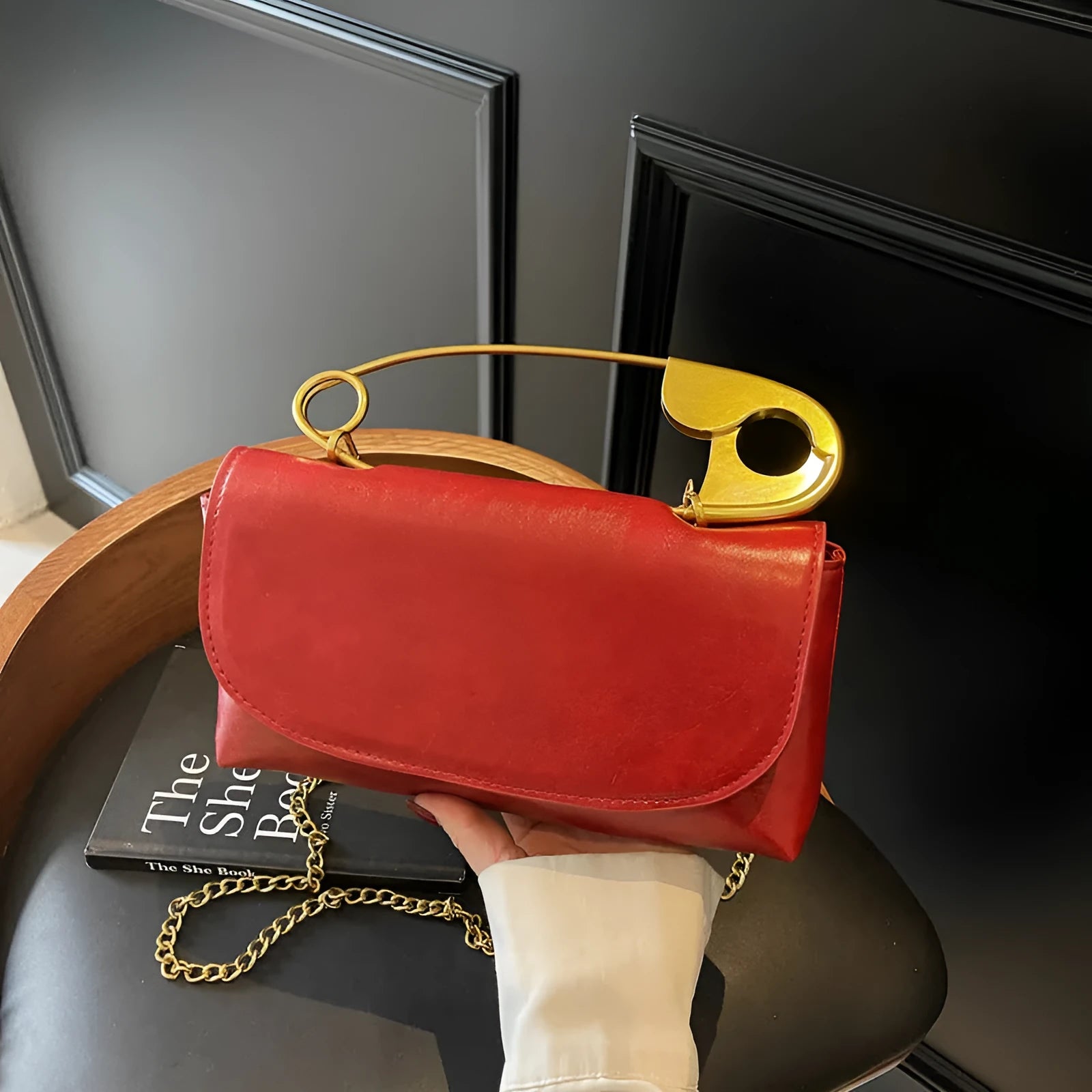 Creative Personality PU paper clip shoulder handbag in a horizontal square shape.