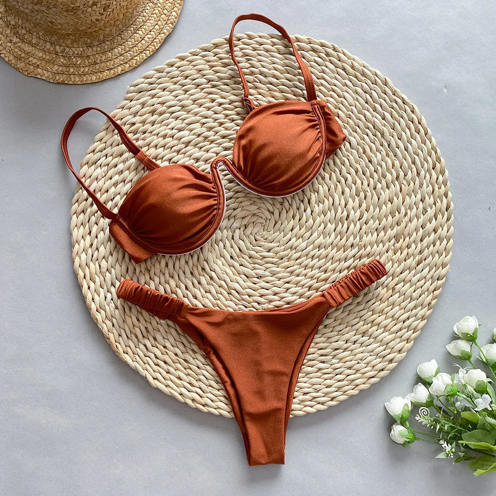 Women's khaki underwire bikini swimsuit with split briefs on a white background.
