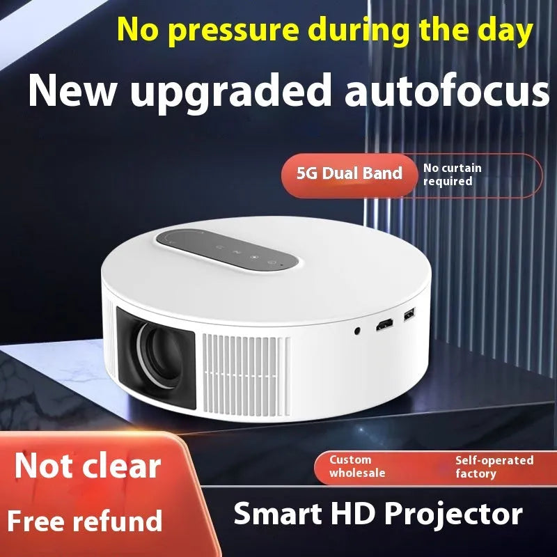 White compact 720p HD home projector with remote control on a table.