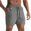 Men's black quick-dry sport shorts with white contrast mesh stitching on the sides.