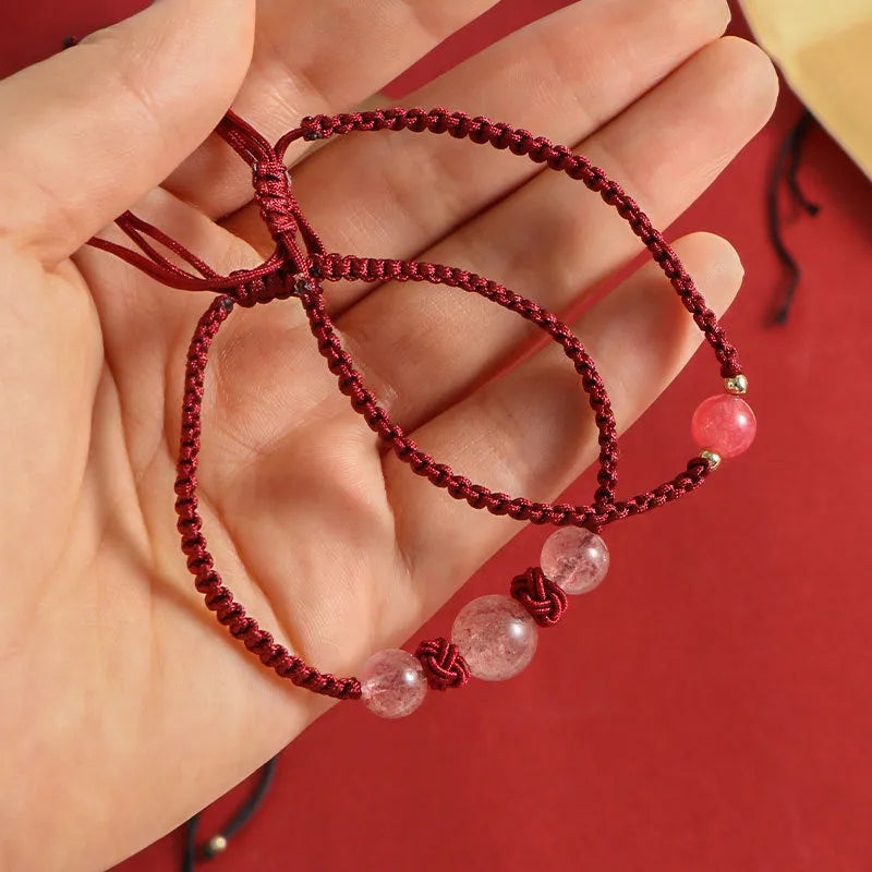 Natural strawberry quartz beaded bracelet on woven red rope with alloy clasp